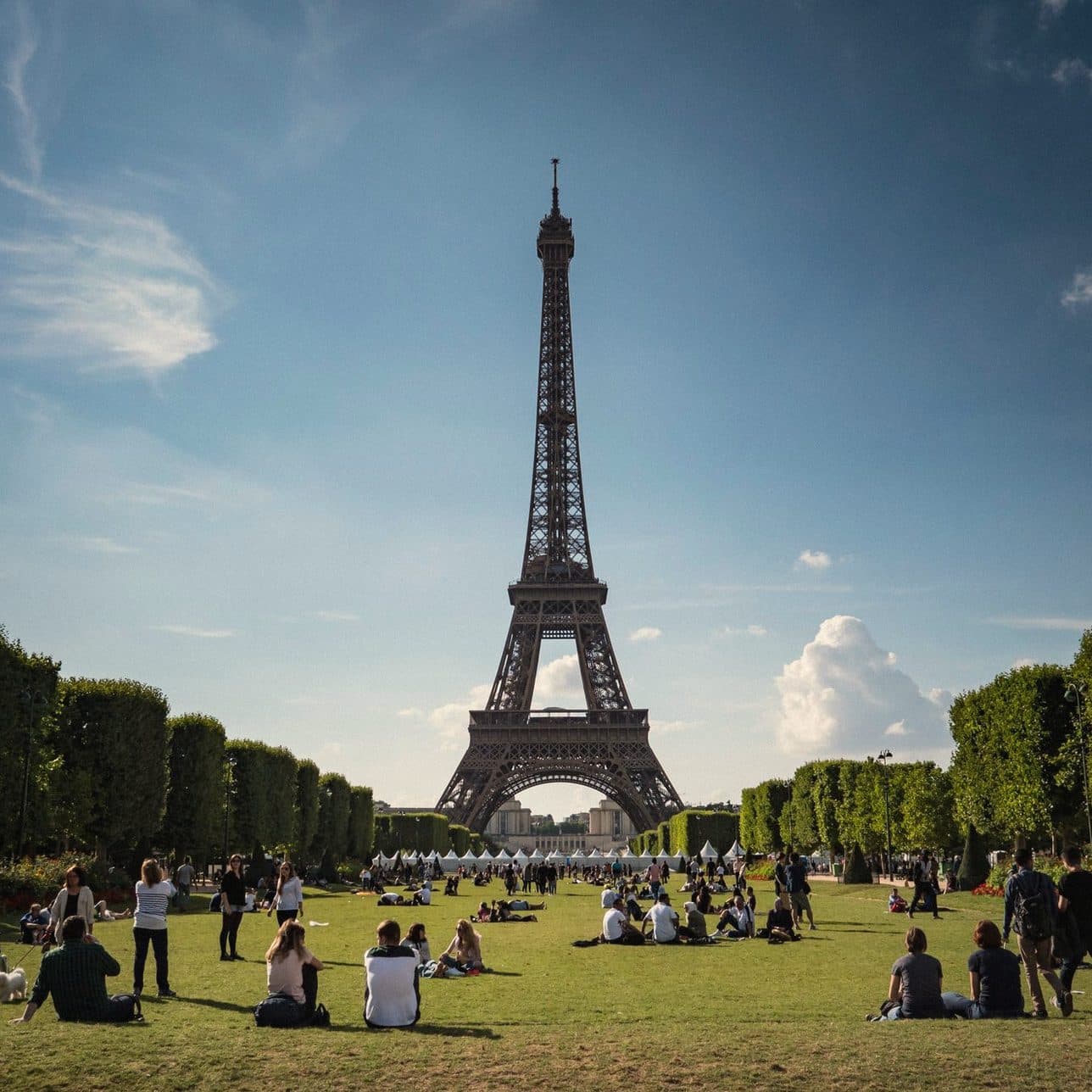 People sitting on the lawn of the Champ de Mars